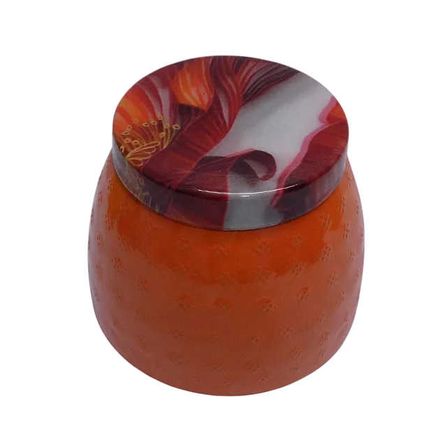round metal dryfruit jar with printed lid